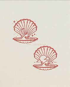 two red scallop shells sitting on top of each other