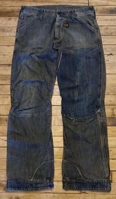 *These vintage distressed G-Star jeans are so cool and in good condition.  They are 100% cotton and have just the right combination of fit and style to make your day a little cooler! *The measurements of these super cool vintage G-Star jeans are 32 waist/32 length. The bottom flare of the pants measures 10"/25 cm. They weigh approximately four pounds. *For more cool vintage, check out www.itsamodmodworldshop.etsy.com/ Distressed Cotton Cargo Jeans In Grunge Style, Baggy Cotton Jeans With Zip Fly, Grunge Medium Wash Cotton Cargo Jeans, Grunge Cargo Jeans In Medium Wash, Faded Distressed Cotton Cargo Jeans, 90s Style Distressed Cotton Jeans, 90s Distressed Cotton Jeans, Y2k Style Washed Cotton Jeans, Jeans G Star