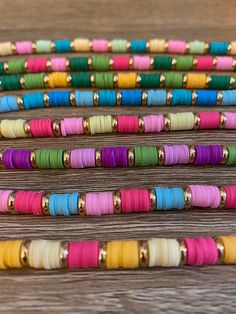 multicolored bracelets are sitting on a table