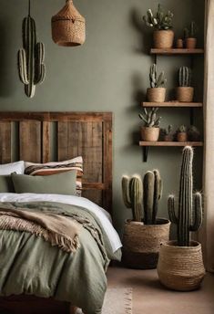 a bedroom with green walls and cactus decorations