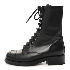 This is an authentic pair of CHANEL Calfskin Lace Up Combat Boots size 38 in Black. These stunning boots are crafted of calfskin leather in black. The boots feature a 1.25-inch heel and a leather cap toe with a stitched Chanel CC logo. Lace Up Combat Boots, Leather Cap, Cc Logo, Combat Boots, Calf Skin, Chanel, Lace Up, Thing 1, Boots