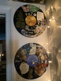 there are two clocks that have been decorated with pictures and lights on the side of the wall