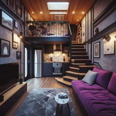 a living room filled with furniture and pictures on the wall next to a stair case