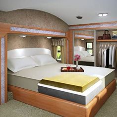 a large bed sitting inside of a bedroom next to a closet