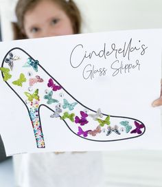 a woman holding up a card with butterflies on it and the words cinderella's glass slipper