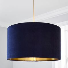 a blue lamp hanging from a ceiling in a room