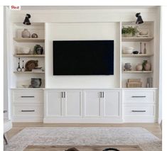 a flat screen tv mounted to the side of a white entertainment center in a living room