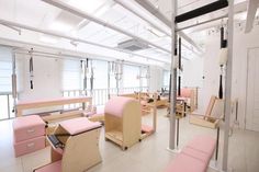 a room filled with lots of pink furniture