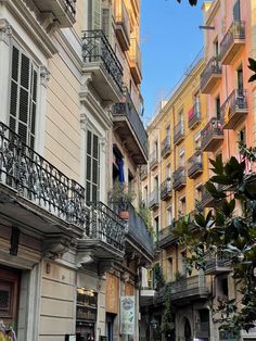 an alleyway with several buildings and balconies