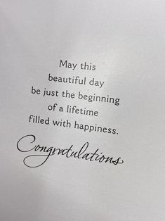 a piece of paper with the words congratulations written on it in cursive writing