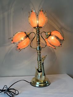 a lamp that is on top of a table with some kind of thing in it