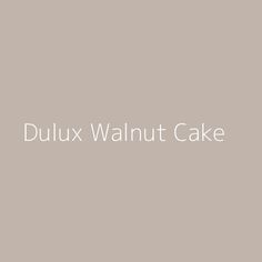 the words dulux walnut cake on a gray background