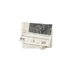 a newspaper with an image of two trees on the front and one in the back