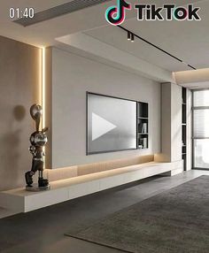 a modern living room with white walls and grey carpeted flooring is featured in this image