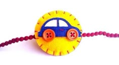 a yellow and blue toy car sitting on top of a red cord