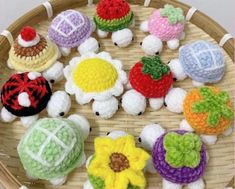 small crocheted toys are arranged in a basket