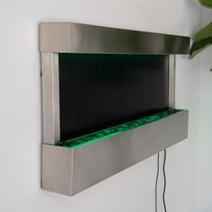 a metal shelf with green lights on it