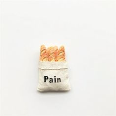 a bag filled with cookies sitting on top of a white table