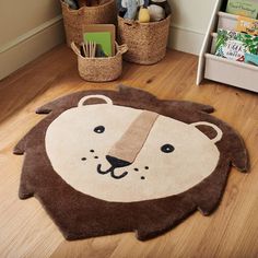 a brown and white rug with a lion face on the floor next to bookshelves