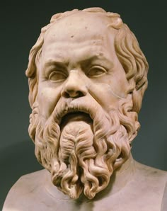 a bust of a man with long hair and beard