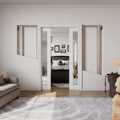 a teddy bear is sitting in the middle of a living room with white walls and wood floors