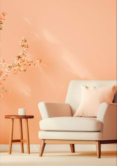 a living room with a chair, table and flowers on the wall in front of it