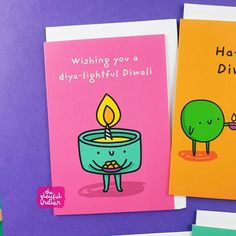 two greeting cards, one with a candle and the other with a tree on it