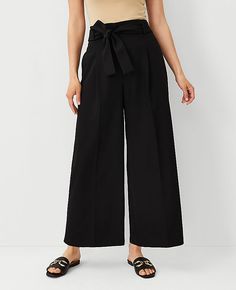 Elevate your wardrobe with the Ann Taylor Tall Tie Waist Wide Ankle Pant, a piece that marries comfort with chic style. This pant features a high-rise, wide-leg design that flatters and elongates your silhouette, making it a versatile addition to both your work and weekend attire.

- **Size**: 10
- **Color**: Black
- **Material**: 73% Polyester, 20% Rayon, 7% Spandex
- **Gender**: Female
- **Fit**: Relaxed and easy
- **Length**: Hits at ankle, 30 1/2" inseam with a 27" leg opening
- **Features** Black Ankle-length Dress Pants With Pockets, Black Relaxed Fit Wide Leg Ankle-length Pants, Black Non-stretch Ankle-length Pants, Black Ankle-length Dress Pants With Elastic Waistband, Luxury Black Ankle-length Wide Leg Pants, Tall Pants, Petite Pants, Ankle Pants, Waist Length