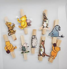 several wooden pegs with different cartoon characters on them