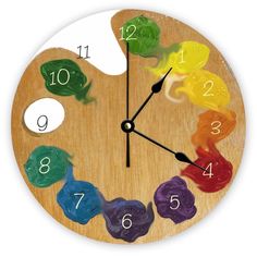 a wooden clock with colorful gummy bears on it