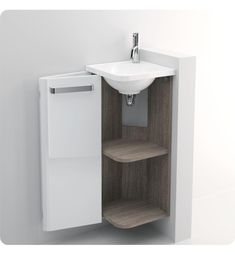 a white sink sitting next to a wooden cabinet