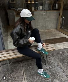 Black leggings, leather bomber jacket, baseball hat, green Adidas Gazelle indoor | Leggings outfits, school outfits, casual outfits, fall outfits, sporty chic | Back-to-School Outfits How To Style Leather Leggings, Green Shoes Outfit, Adidas Sneakers Outfit, Adidas Gazelle Outfit, Adidas Samba Outfits, Samba Outfits, Adidas Outfit Women