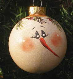 an ornament with a face drawn on it