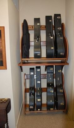 a guitar case sitting on top of a wooden shelf