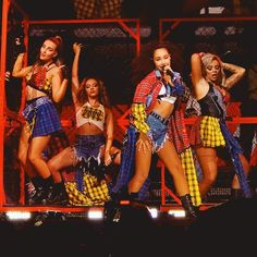 the dancers are all dressed in plaid outfits