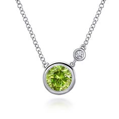 Crafted from polished 925 sterling silver and set on a slim cable chain, this sensational necklace flaunts a bezel set round peridot centerpiece. Sophisticated sparkle is added by a petite .02ct round accent diamond. This vibrant green birthstone necklace is a meaningful gift for an August birthday. Meaningful Necklace, Stackable Diamond Rings, Fine Jewelery, Peridot Necklace, Diamond Bangles Bracelet, Colourful Necklace, Diamond Pendant Necklace, Pearl Stud Earrings