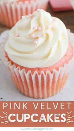 pink velvet cupcakes with white frosting and sprinkles