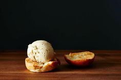 an apple and ice cream sitting on top of a wooden table