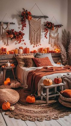 a bedroom decorated with pumpkins and wicker baskets on the floor, along with candles