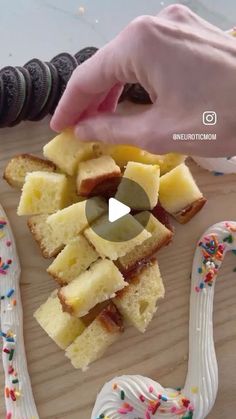 someone is cutting into slices of cake with sprinkles