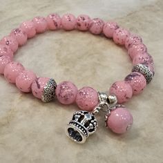 New And Unworn, Pink Beaded, Stretch Bracelet With Queen Charm Nickel-free Stretch Bracelet With Round Beads, Adjustable Pink Beaded Bracelet With Silver Beads, Handmade Silver Charm Bracelet With Round Beads, Adjustable Silver Beads, Silver Bohemian Crystal Bracelet With 8mm Beads, Adjustable Beaded Bracelets With 8mm Beads, Silver Bracelet With Round Metal Beads, Nickel-free Stretch Bracelet For Jewelry Making, Silver Metal Bead Bracelets For Gift