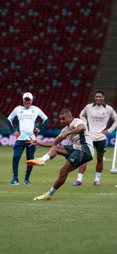 the soccer players are practicing their moves on the field