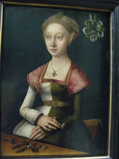 a portrait of a woman in an ornate dress