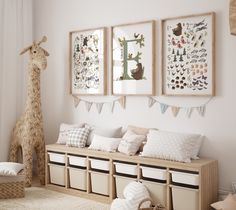 a room filled with lots of pillows and stuffed animals on top of the wall next to storage bins