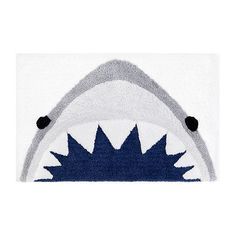 a rug with a shark's teeth on the front and back of its mouth