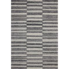 an area rug with grey and white stripes