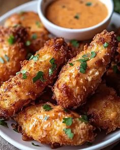 fried food on a plate with dipping sauce