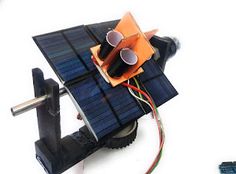 an image of a solar powered device with wires attached to the back side of it