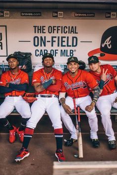 the baseball players are posing for a team photo in their dugout at home plate