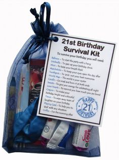 the 21st birthday survival kit is packed in a blue organ bag with its contents labeled